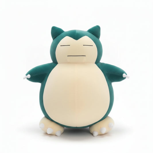 Plush toy resembling a green and beige creature on a white surface with a blurred background