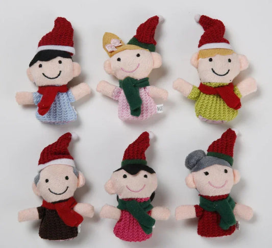 Set of six knitted Christmas elves with red hats and scarves on a white background