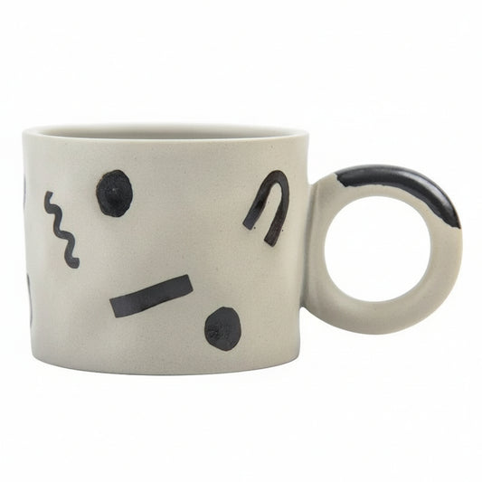 Mug with a face design on a white background