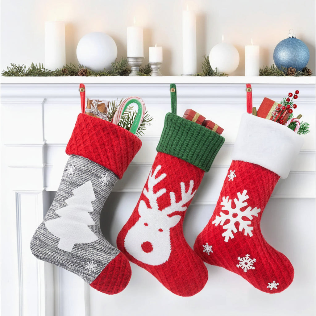 Three Christmas stockings with festive designs hanging on a fireplace mantle.