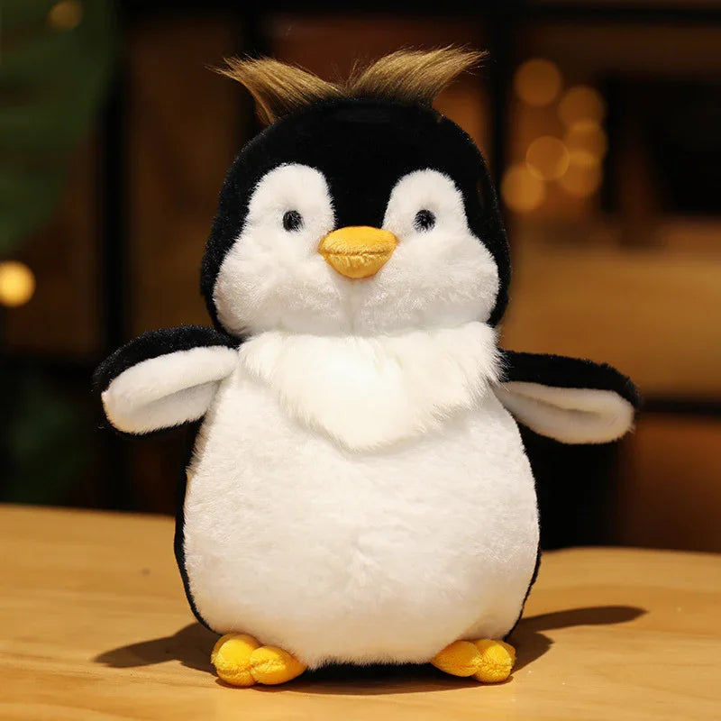 Plush penguin toy on a wooden surface with a blurred warm background