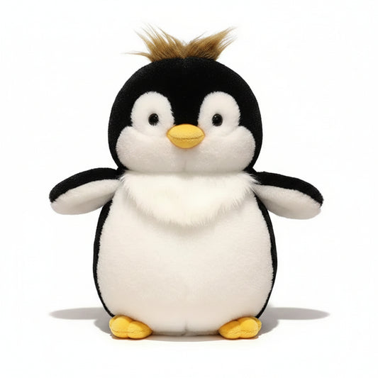 Plush penguin toy on a wooden surface with a blurred warm background