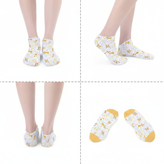 White socks with yellow patterns worn by a person on a white background